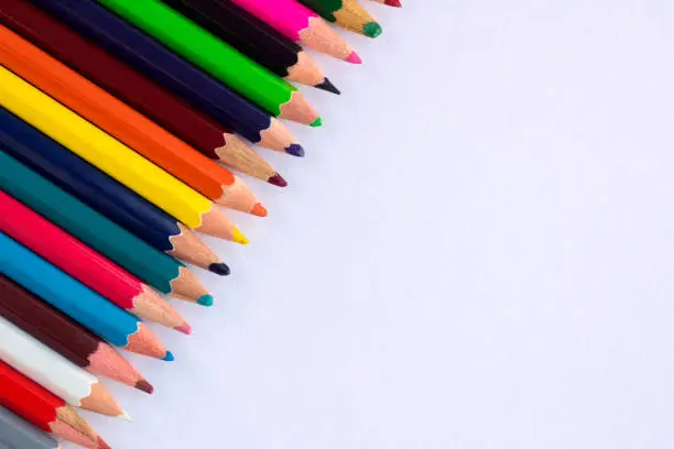 Photo of White background for presentations with colourful right upper pencils corner