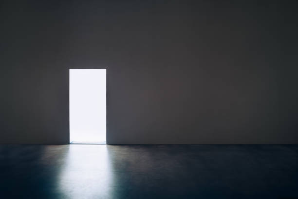 istock Light door in dark room 639252724