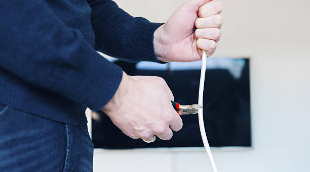 istock Ending cable subscription by cutting television cable 639255944