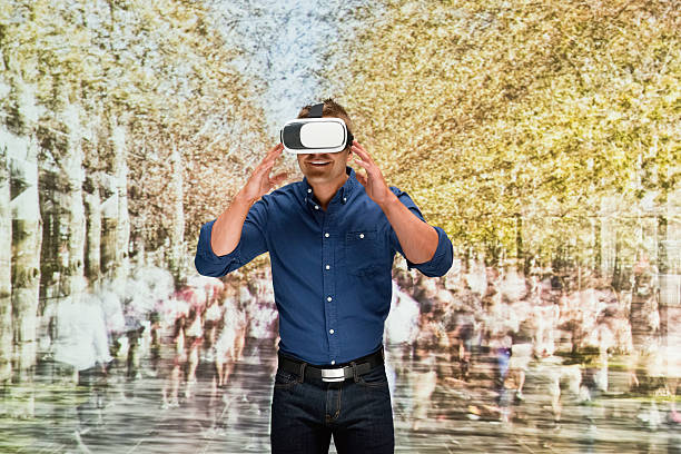 istock Man using virtual reality headset outdoors 639255950