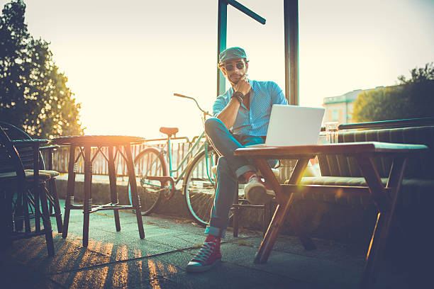 istock Man working outdoor with a laptop 639257620