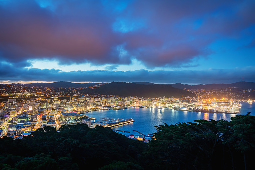 Aerial panoramic view of Wellington Cityscape during Sunset - Twilight under beautiful summer cloudscape. Wellington, North Island, New Zealand, Oceania