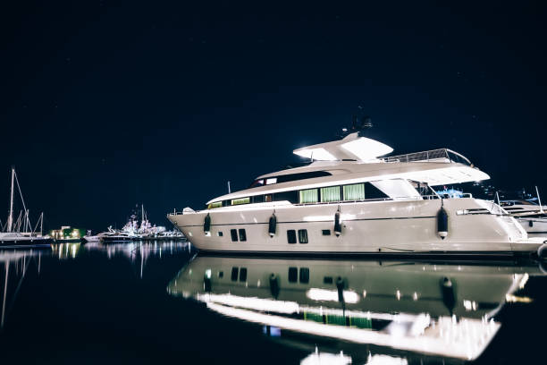 istock Luxury yachts in La Spezia harbor at night with reflection 639259220