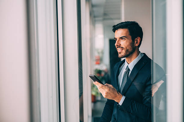 istock Buisnessman Texting On The Phone 639260560