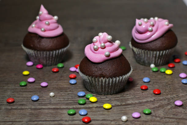 istock Chocolate cupcakes with strawberries cream 639261690