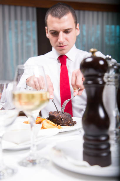 istock Businessman having lunch at the restaurant. 639261840