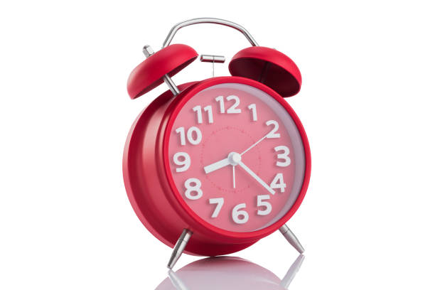 istock Red alarm clock shows isolated on white 639264470