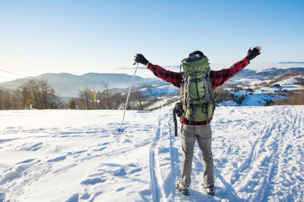 istock Man hiking on the snowy mountain 639267082