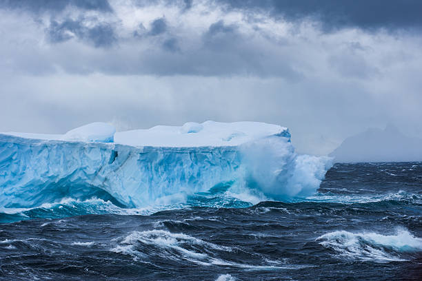 istock Massive Iceberg floating in Antarctica in a storm 639267262