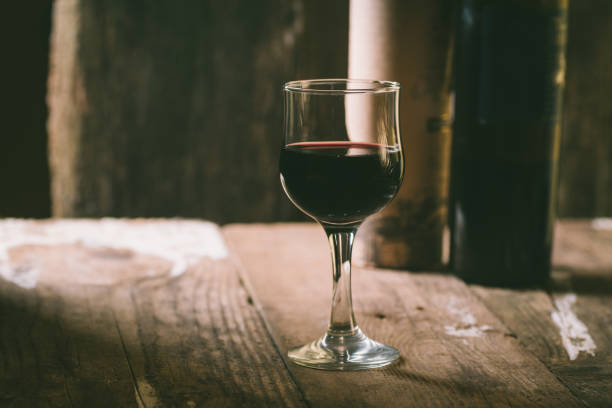 istock Glass of wine on a table 639270960