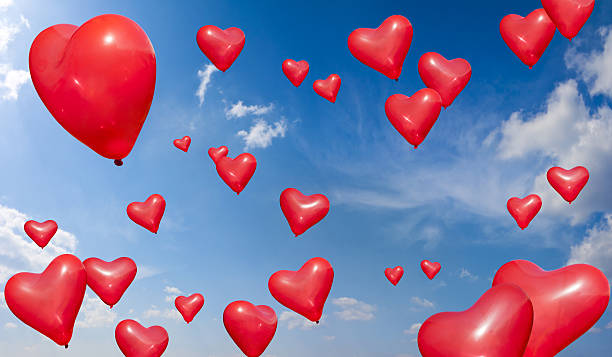 istock Heart Shape Balloons into blue sky 639270962