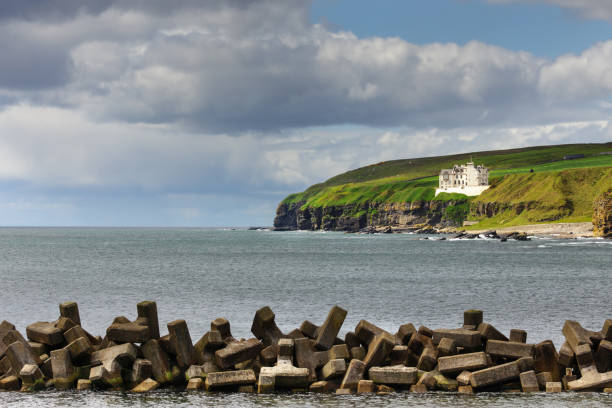 istock Dunbeath harbor and castle on cliff, Scotland. 639276420