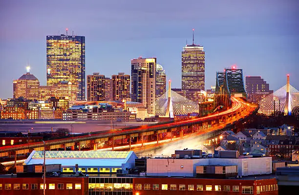 US route 1 traffic leading into downtown Boston, Massachusetts during rush hour. Boston is the largest city in New England, the capital of the state of Massachusetts. Boston is known for its central role in American history,world-class educational institutions, cultural facilities, and champion sports 