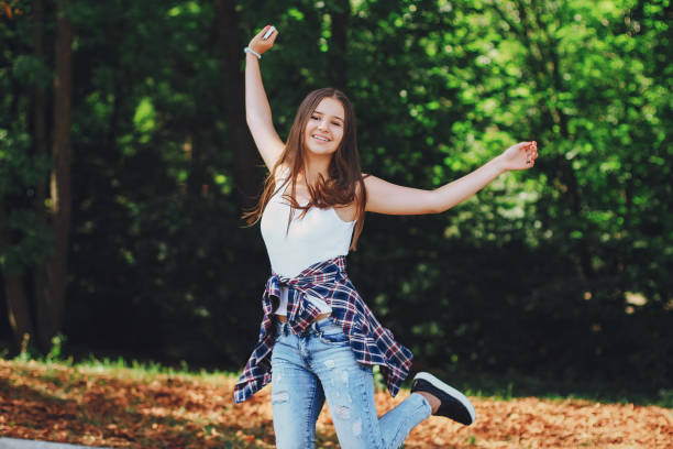 istock young beautiful girl walking park 639282354