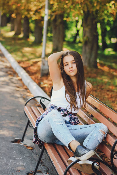 istock young beautiful girl walking park 639282382