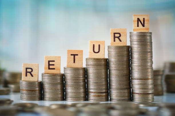 istock Stack of Coins with Wooden Letters 639282666