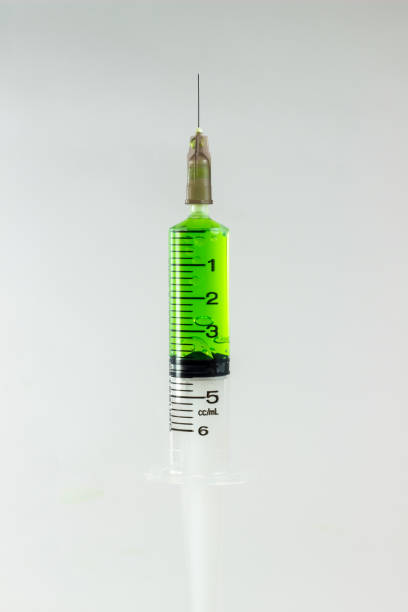 istock plastic medical syringes containing multicolor solutions in medicine glass 639282822
