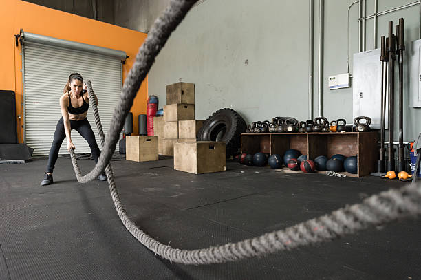 istock Beautiful Hispanic Women Working Out On The Ropes 639291046