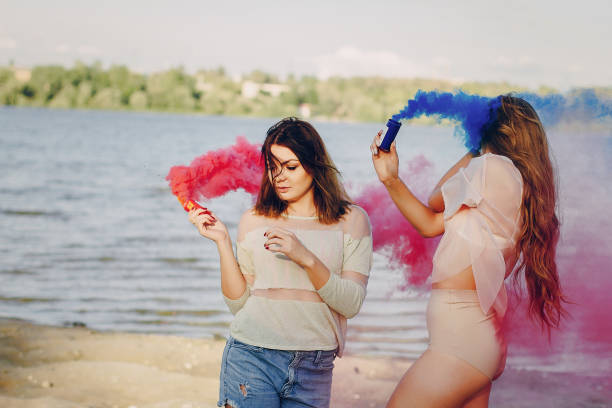 istock two girls resting on the beach 639291184