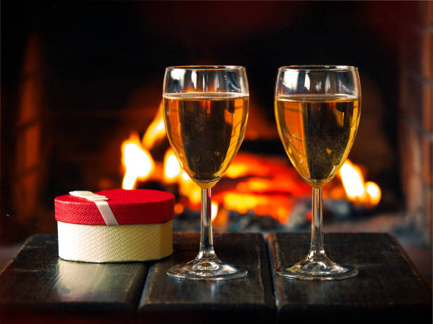 istock Two glasses of wine and a gift box 639297156