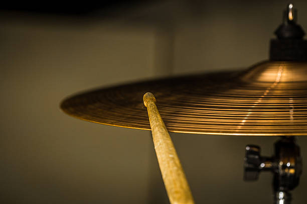 istock plays a drum stick on the hi-hat or ride cymbal 639298344