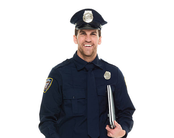 istock Smiling police holding laptop 639298488