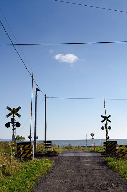 istock Railroad crossing with sea view 639299684