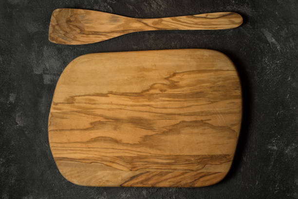 istock empty olive wood cutting board and wooden paddle for stirring 639299906
