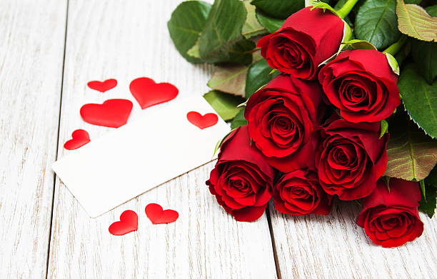 istock Red roses and greeting card 639300098
