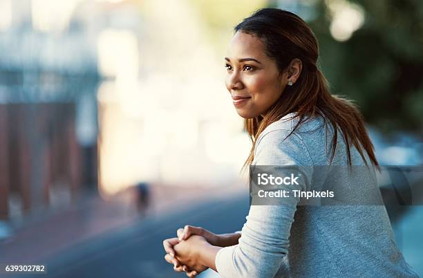 Doing Some Thinking On The Balcony Stock Photo - Download Image Now - Women, Contemplation, One Woman Only