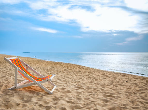 istock beach chair on tropical white sand 639303172