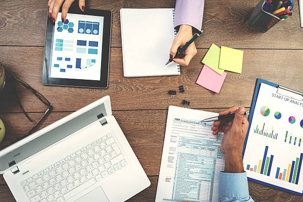 istock Teamwork in office with two finance employees 639304142