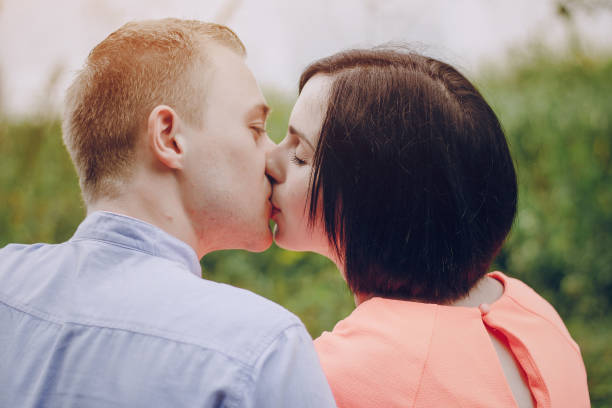 istock loving couple walking park 639304200