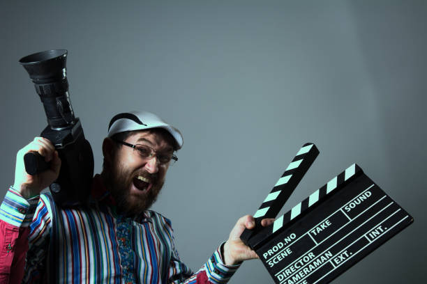 istock Screaming man retro movie camera and clapperboard 639306346