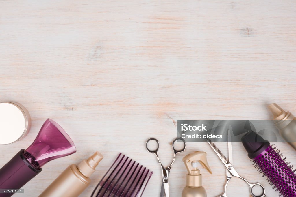 Hairdresser tools on wooden background with copy space at top Hair Salon Stock Photo