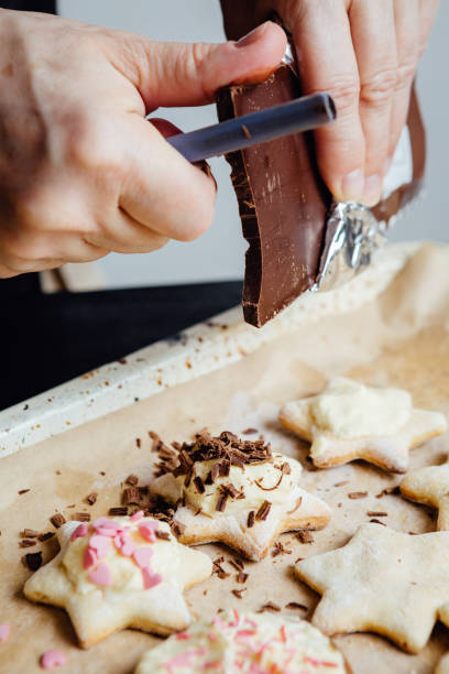 istock Cook decorating cookies with chocolate 639309520