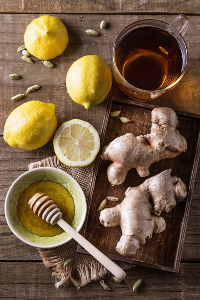istock Cup of lemon ginger tea over rustic background 639310196