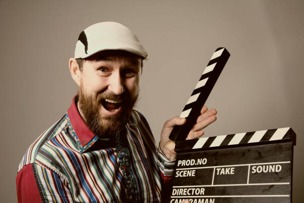 istock Close-up of a man smiling clapperboard cinema 639310292