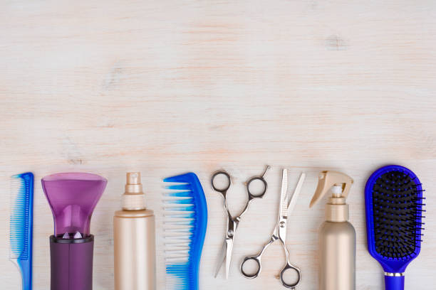 istock Professional hairdresser tools on wooden surface with copyspace at top 639310482