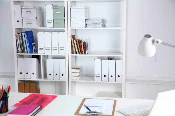 istock Modern office interior with tables, chairs and bookcases 639311880