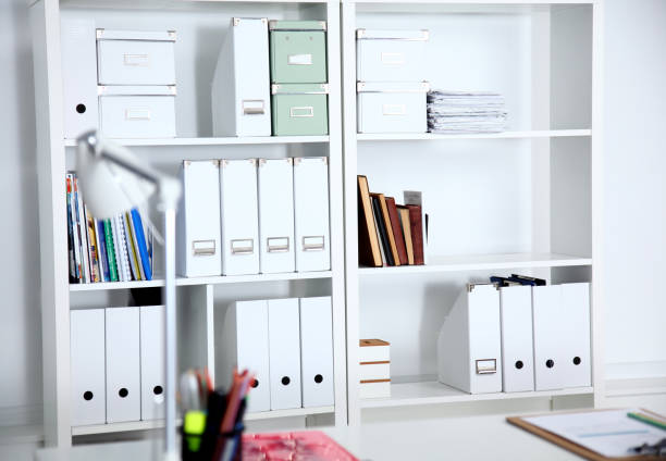 istock Modern office interior with tables, chairs and bookcases 639312090