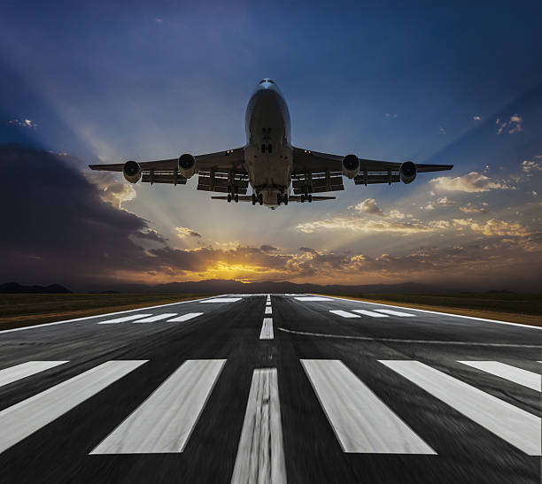 istock Passenger airplane landing at dusk 639312626