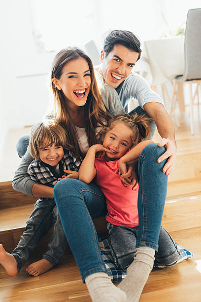 young happy familia - family with two children father clothing smiling fotografías e imágenes de stock