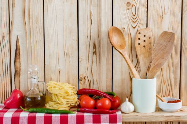 istock Fresh Vegetables And Cooking Utensils On Wooden Shelf 639314494
