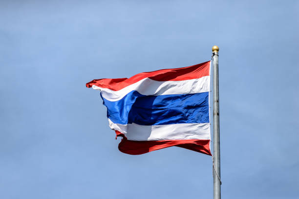 istock Waving Thai flag with blue sky background 639314930