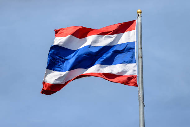istock Waving Thai flag with blue sky background 639314986