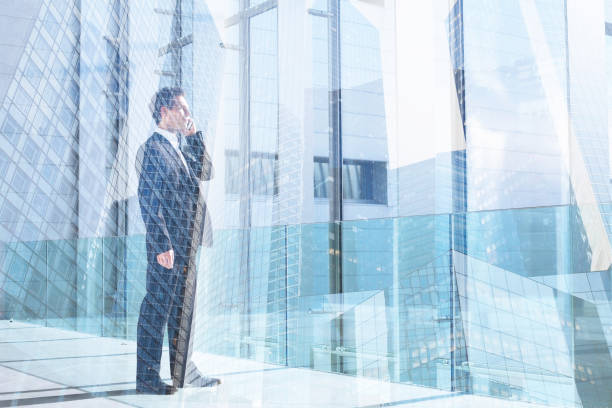 istock business man talking by mobile phone in the office, communication 639318152