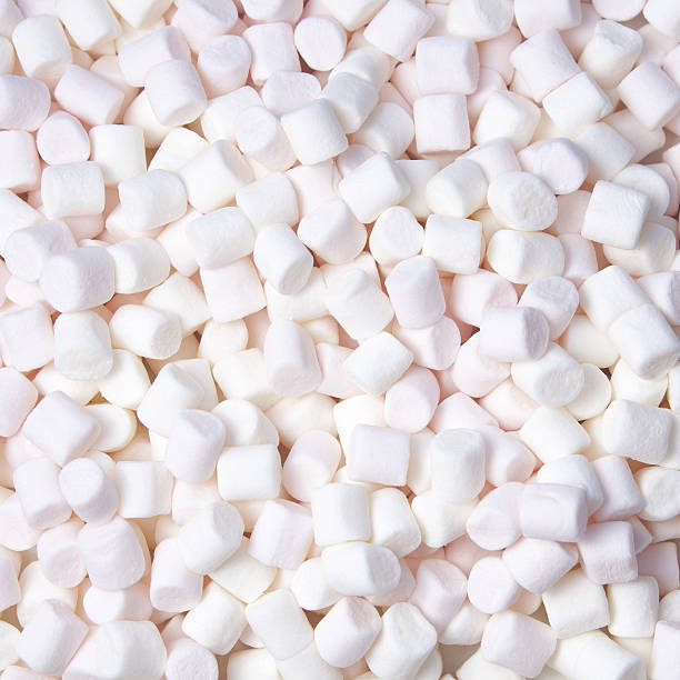 istock pink and white marshmallow background. Top view 639319040