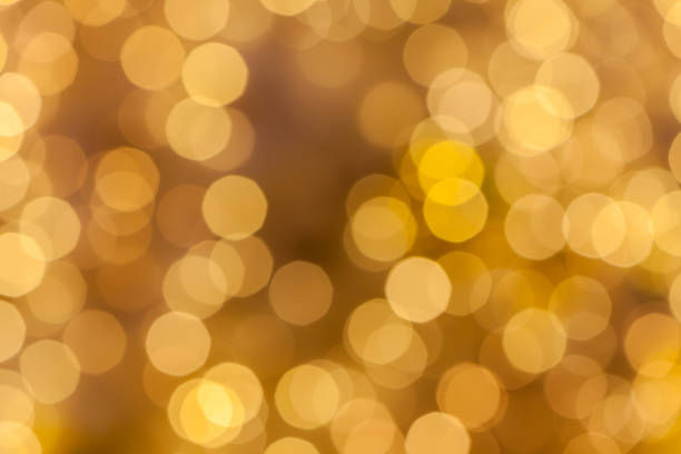 istock Abstract background blurred yellow golden bokeh circles. 639319054