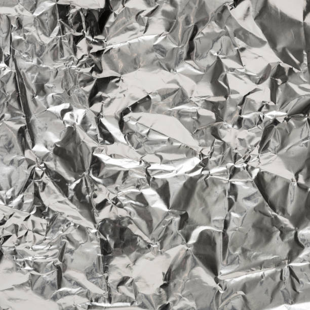 istock Silver wrinkled foil texture for background 639321292